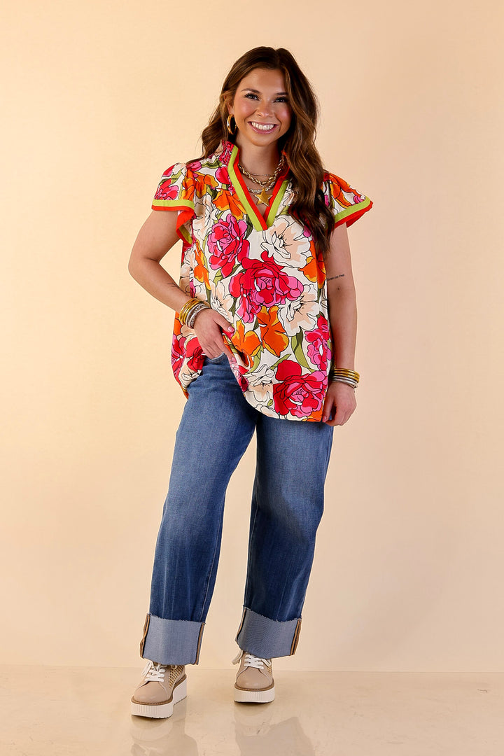 Spring Symphony Floral Print Flutter Sleeve Top with Contrast Trim Split Neckline in Pink and Orange