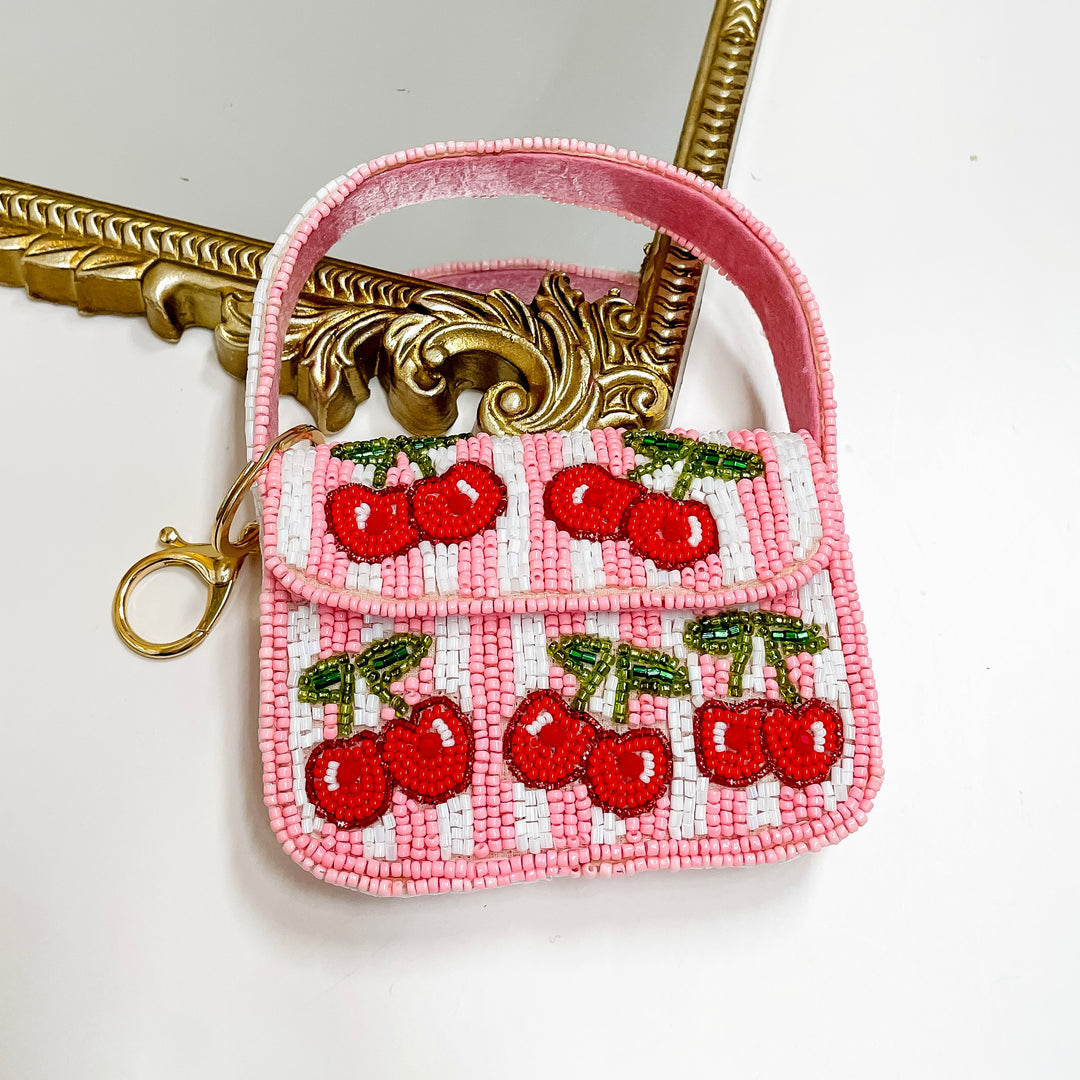 Pink and white striped beaded mini purse with red cherries and gold keychain clip from Giddy Up Glamour.