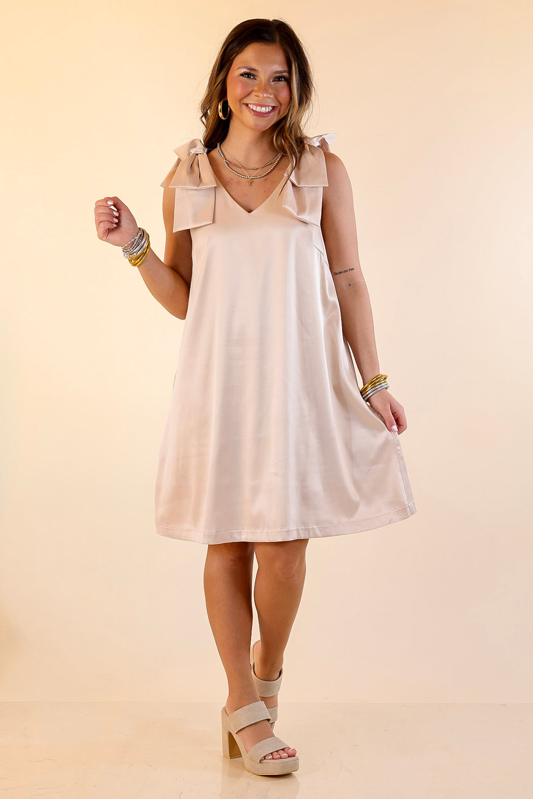 Satin Soirée V Neck Mini Dress with Bow Strap Detailing in Champagne