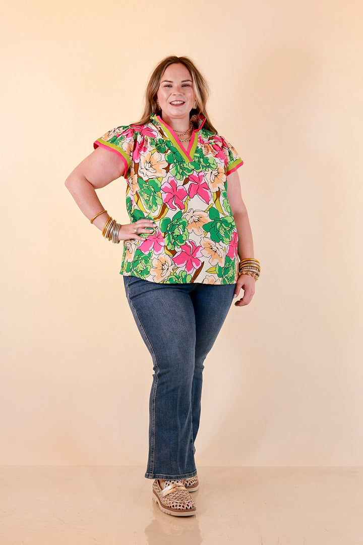 Spring Symphony Floral Print Flutter Sleeve Top with Contrast Trim Split Neckline in Pink and Green