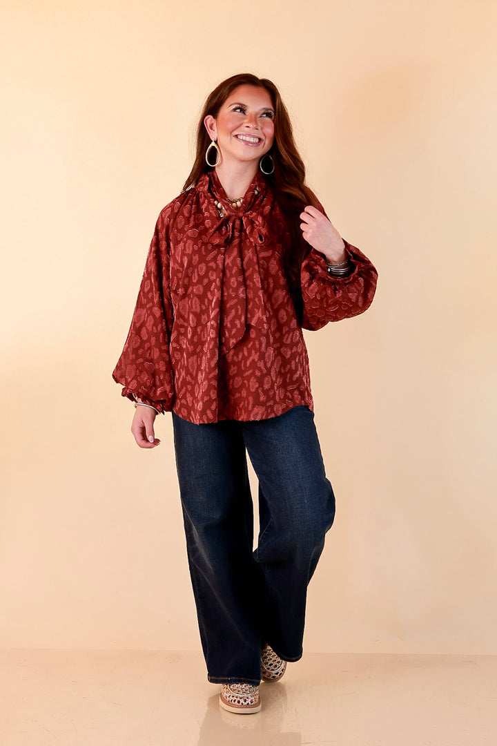 Commanding Attention Tie Neck Velvet Animal Print Balloon Sleeve Blouse in Burgundy