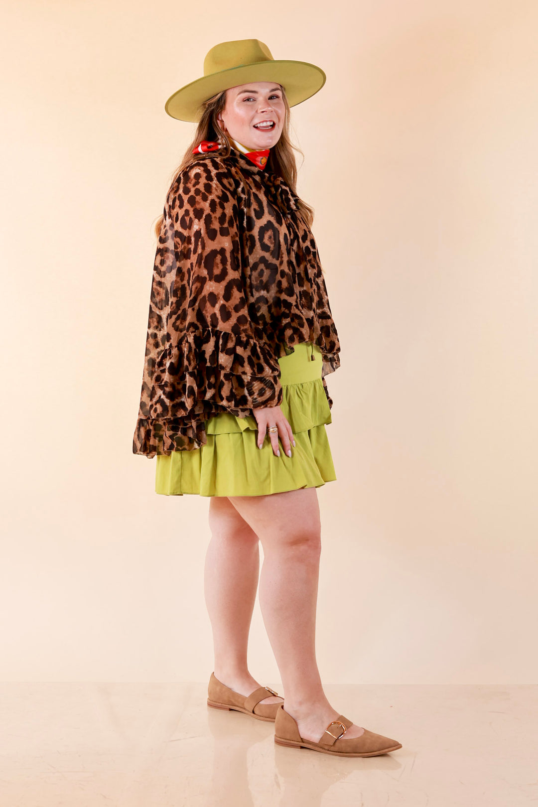 Flirt Factor Long Sleeve Sheer Blouse with Bell Sleeves and Ruffle Detailing and Tie Collar in Leopard Print