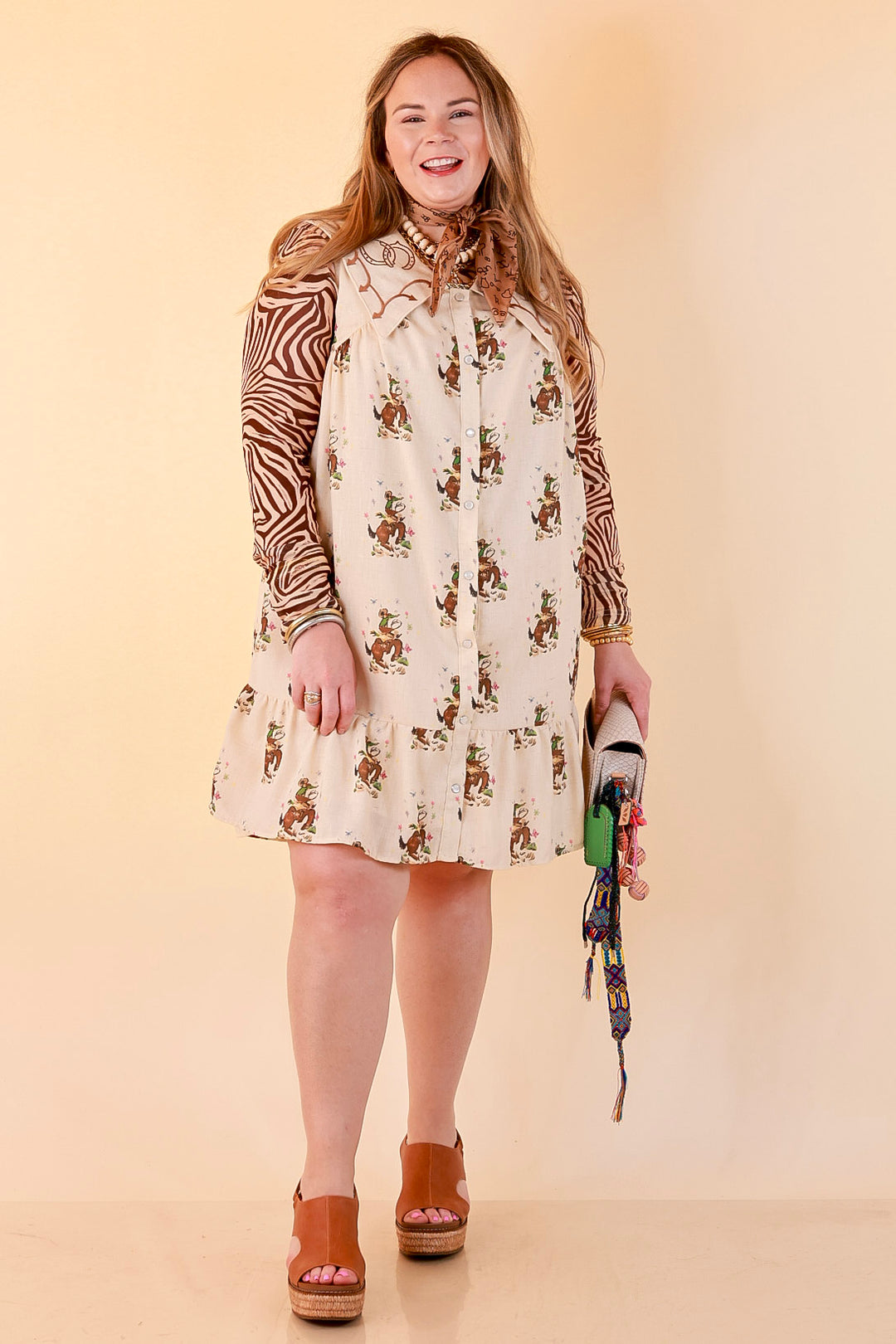 The Showstopper Sleeveless Pearl Snap Bronc Print Ruffle Dress with Sailor Collar and Horseshoe Embroidery in Cream