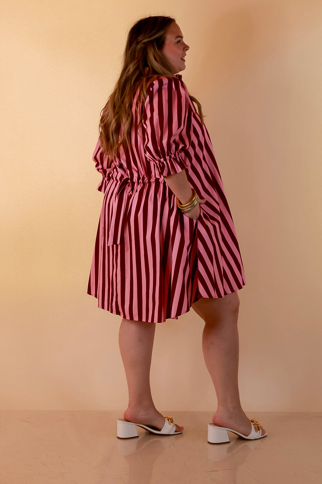 Talk of the Town Striped Ruffle Sleeve Babydoll Dress with Cinched Waist Feature in Maroon and Pink