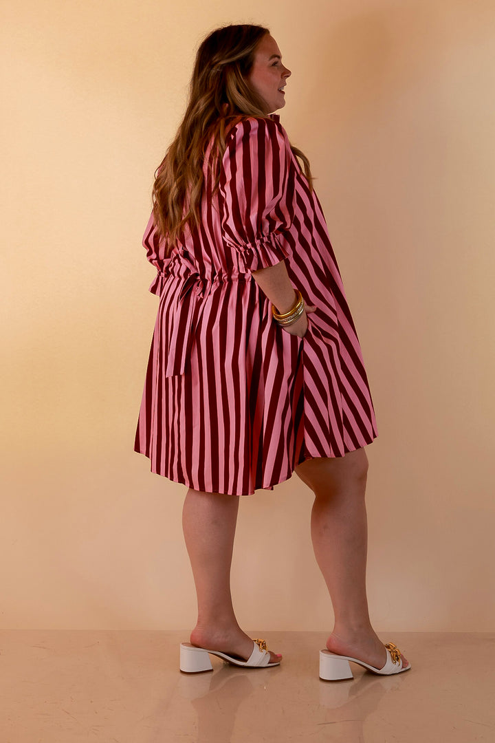 Talk of the Town Striped Ruffle Sleeve Babydoll Dress with Cinched Waist Feature in Maroon and Pink