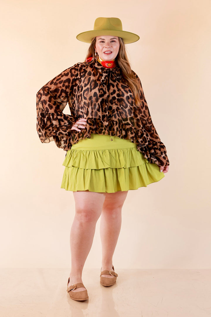 Flirt Factor Long Sleeve Sheer Blouse with Bell Sleeves and Ruffle Detailing and Tie Collar in Leopard Print