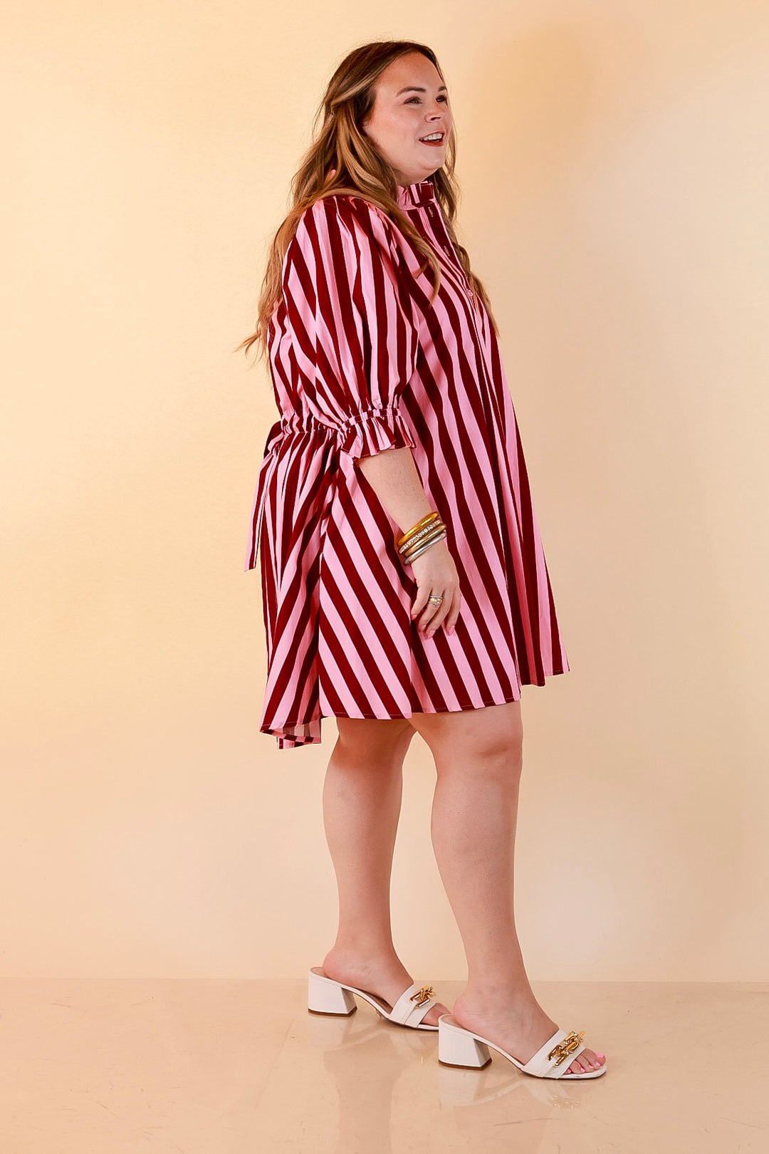 Talk of the Town Striped Ruffle Sleeve Babydoll Dress with Cinched Waist Feature in Maroon and Pink