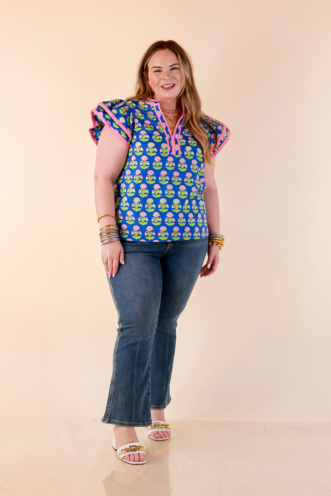 Fresh Perspective V Neck Floral Print Top with Ruffle Cap Flutter Sleeves and Contrast Trim in Royal Blue