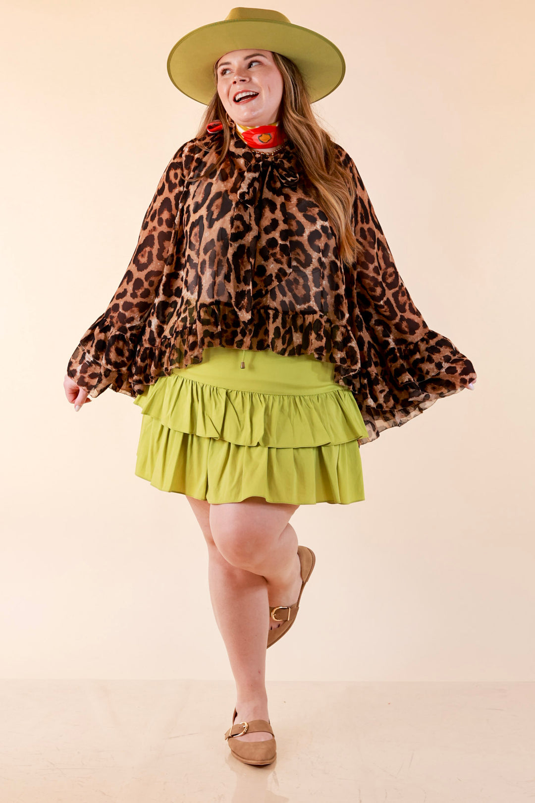Flirt Factor Long Sleeve Sheer Blouse with Bell Sleeves and Ruffle Detailing and Tie Collar in Leopard Print