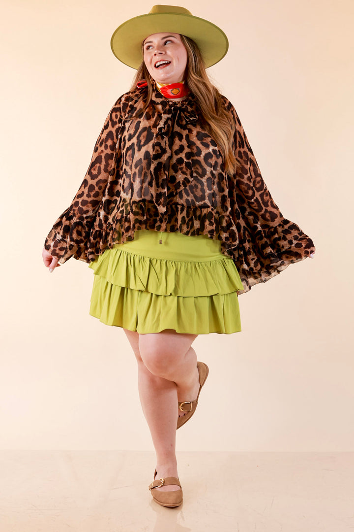 Flirt Factor Long Sleeve Sheer Blouse with Bell Sleeves and Ruffle Detailing and Tie Collar in Leopard Print