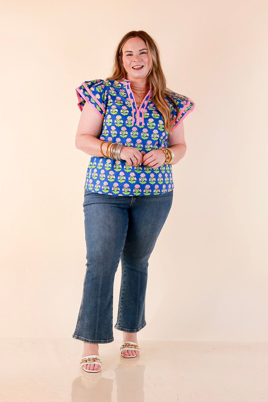 Fresh Perspective V Neck Floral Print Top with Ruffle Cap Flutter Sleeves and Contrast Trim in Royal Blue