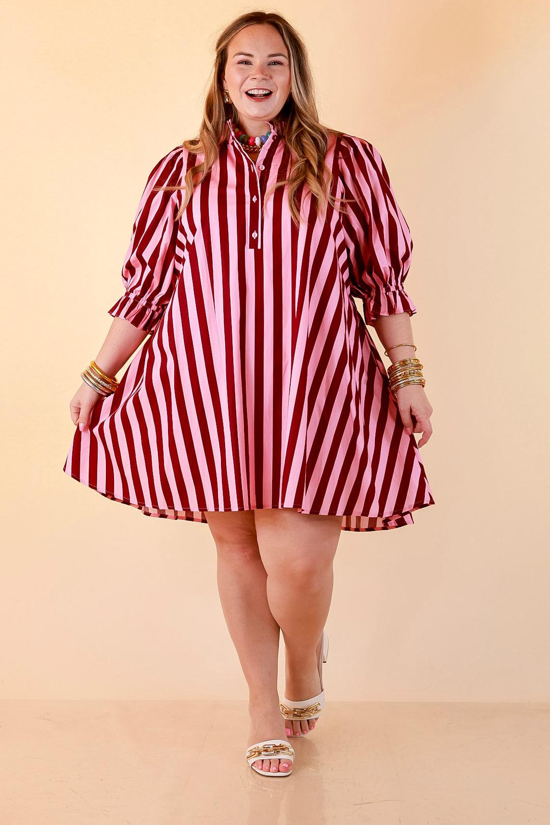Talk of the Town Striped Ruffle Sleeve Babydoll Dress with Cinched Waist Feature in Maroon and Pink