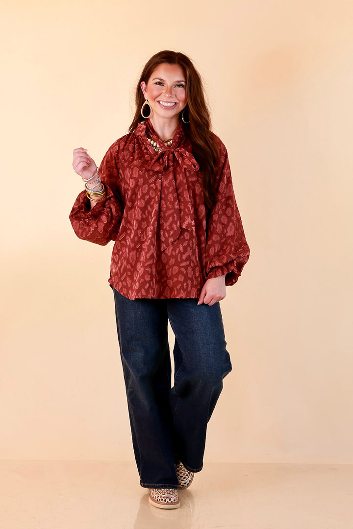 Commanding Attention Tie Neck Velvet Animal Print Balloon Sleeve Blouse in Burgundy