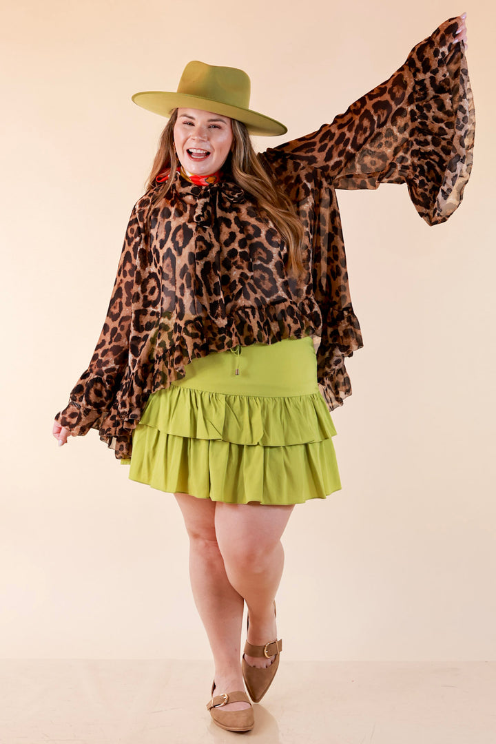 Flirt Factor Long Sleeve Sheer Blouse with Bell Sleeves and Ruffle Detailing and Tie Collar in Leopard Print