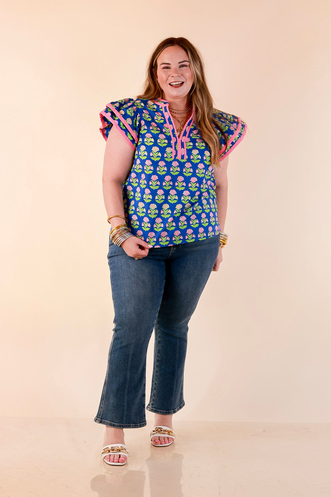 Fresh Perspective V Neck Floral Print Top with Ruffle Cap Flutter Sleeves and Contrast Trim in Royal Blue