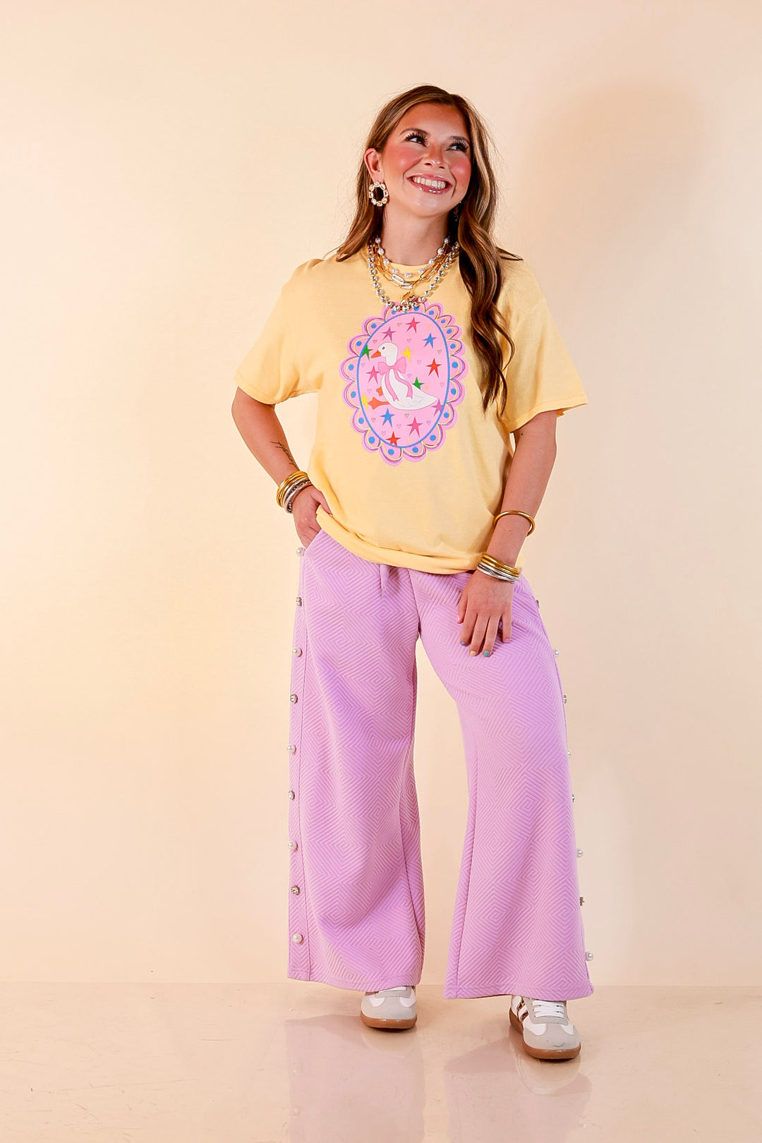 Goose on the Loose Whimsical Pink Background with Stars and Hearts Goose Printed Graphic Tee in Butter Yellow