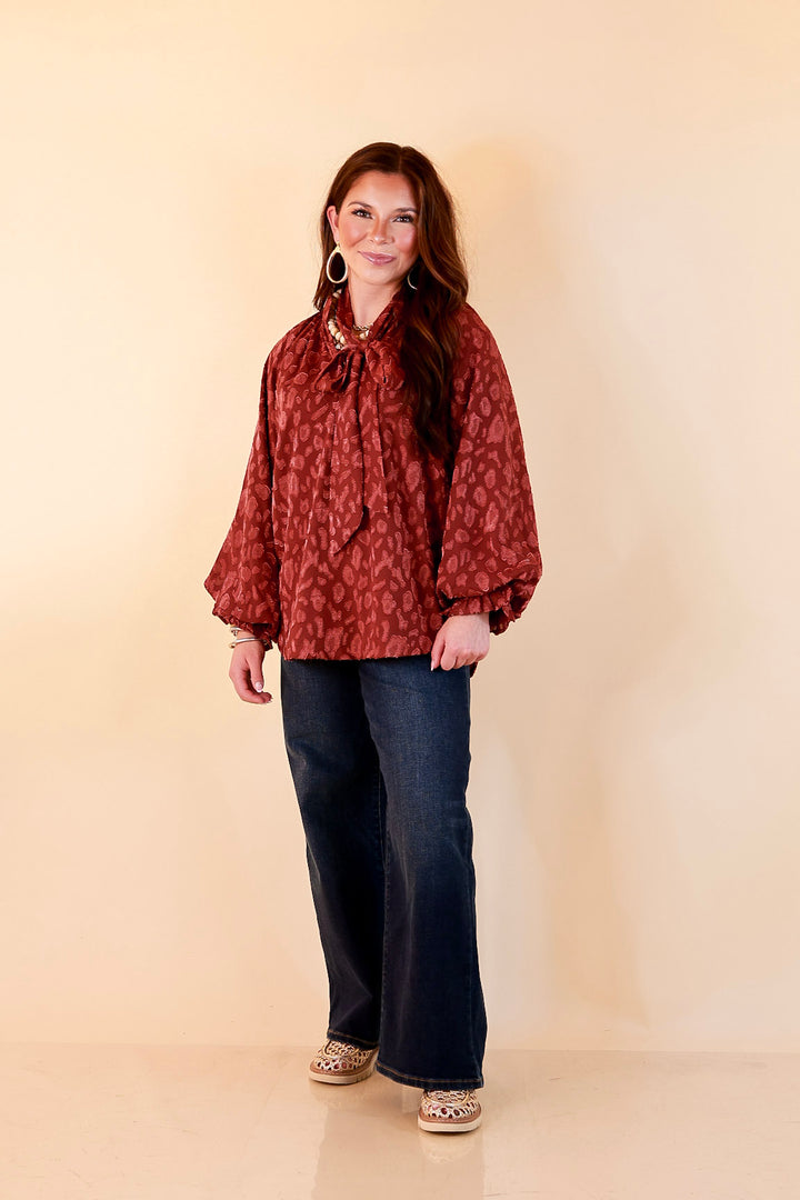 Commanding Attention Tie Neck Velvet Animal Print Balloon Sleeve Blouse in Burgundy