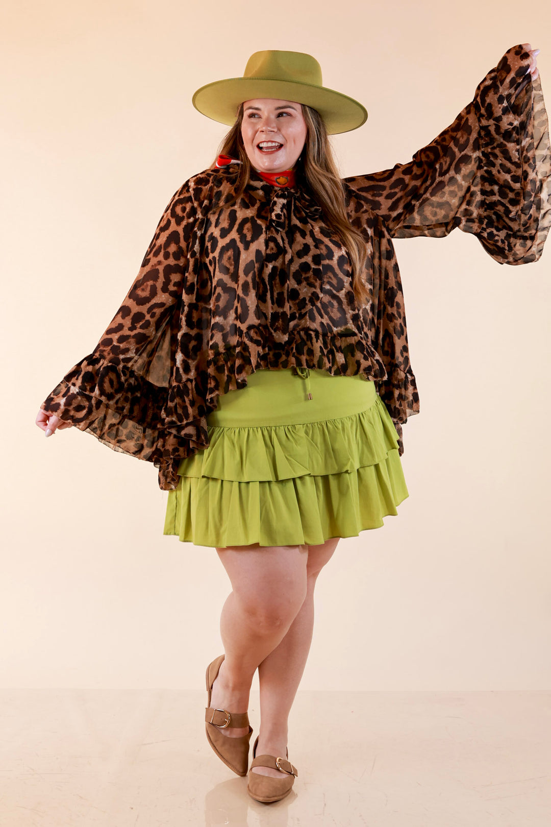 Flirt Factor Long Sleeve Sheer Blouse with Bell Sleeves and Ruffle Detailing and Tie Collar in Leopard Print
