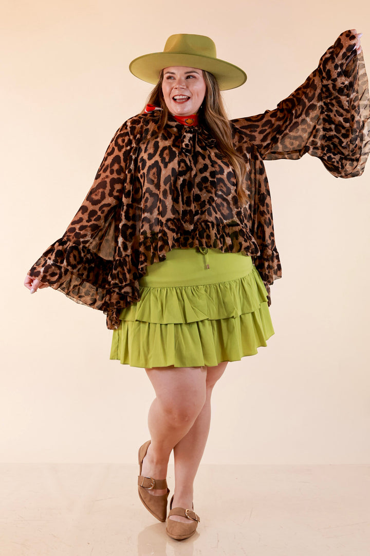 Flirt Factor Long Sleeve Sheer Blouse with Bell Sleeves and Ruffle Detailing and Tie Collar in Leopard Print