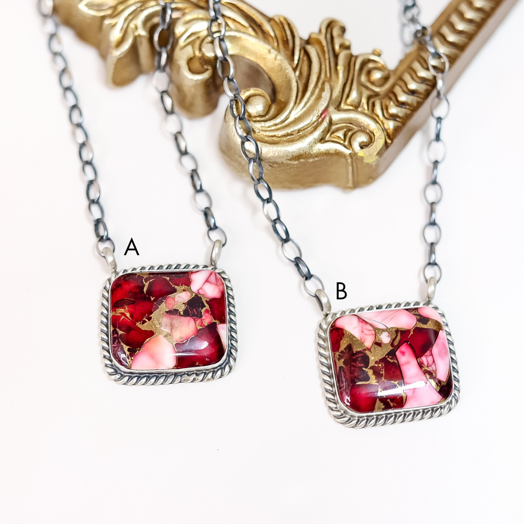 Two necklaces with square pendants featuring floral designs on a white background.