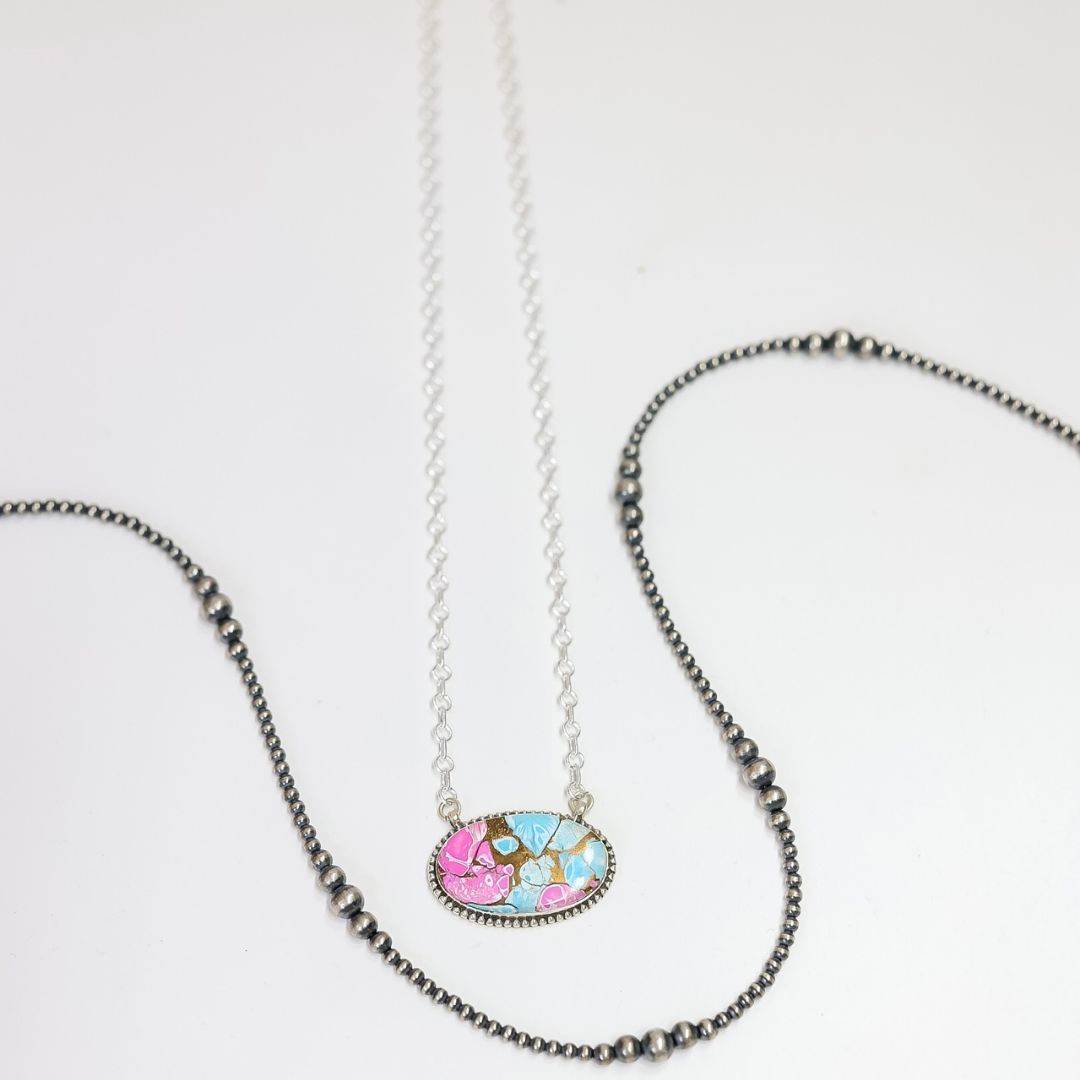 Necklace with a colorful pendant on a white background