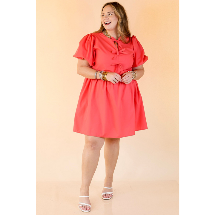 Short and Sweet Dress with Short Puff Sleeves and Bows in Coral Orange