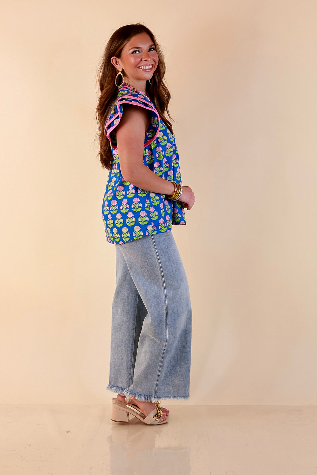 Fresh Perspective V Neck Floral Print Top with Ruffle Cap Flutter Sleeves and Contrast Trim in Royal Blue