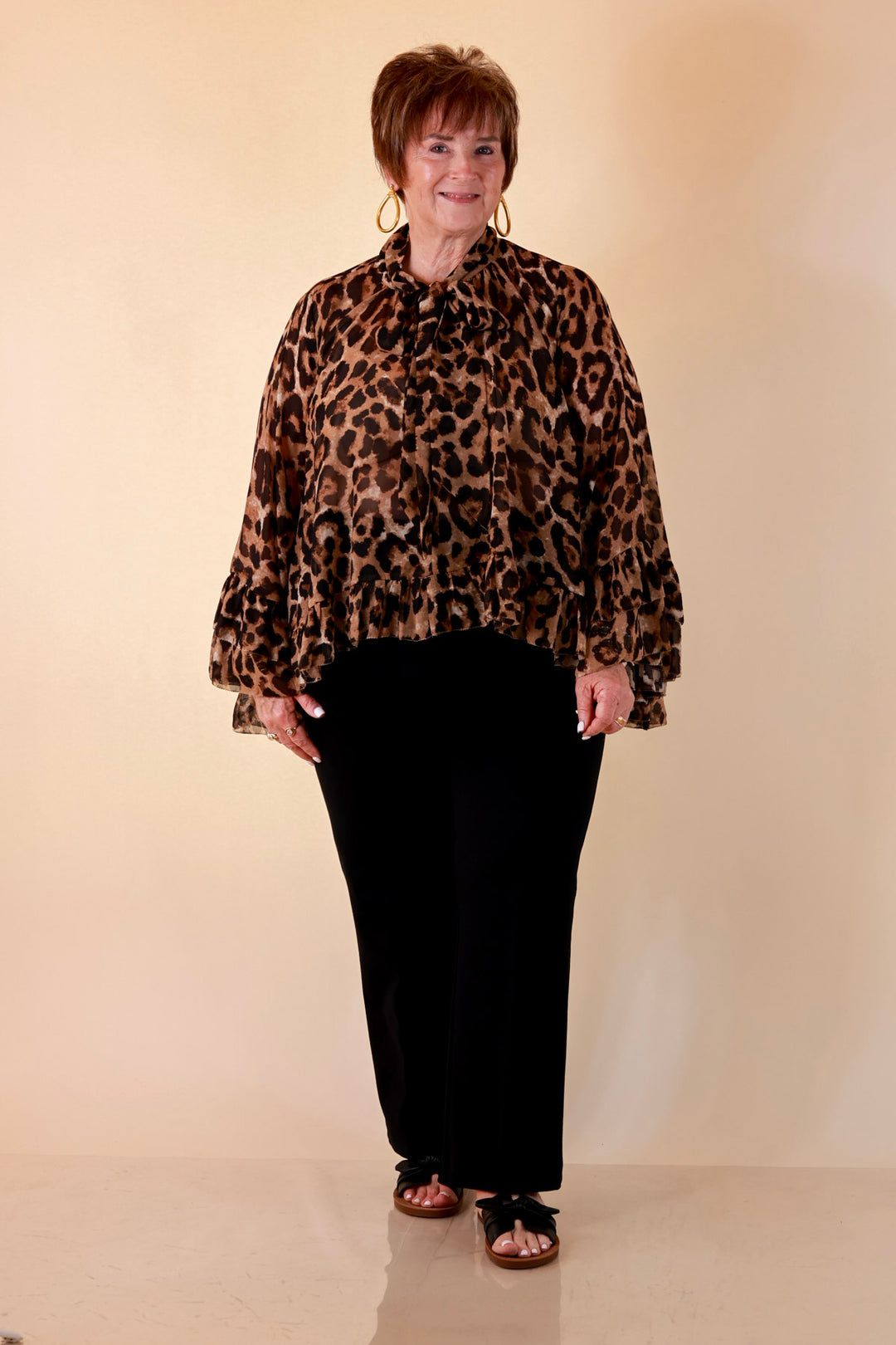 Flirt Factor Long Sleeve Sheer Blouse with Bell Sleeves and Ruffle Detailing and Tie Collar in Leopard Print