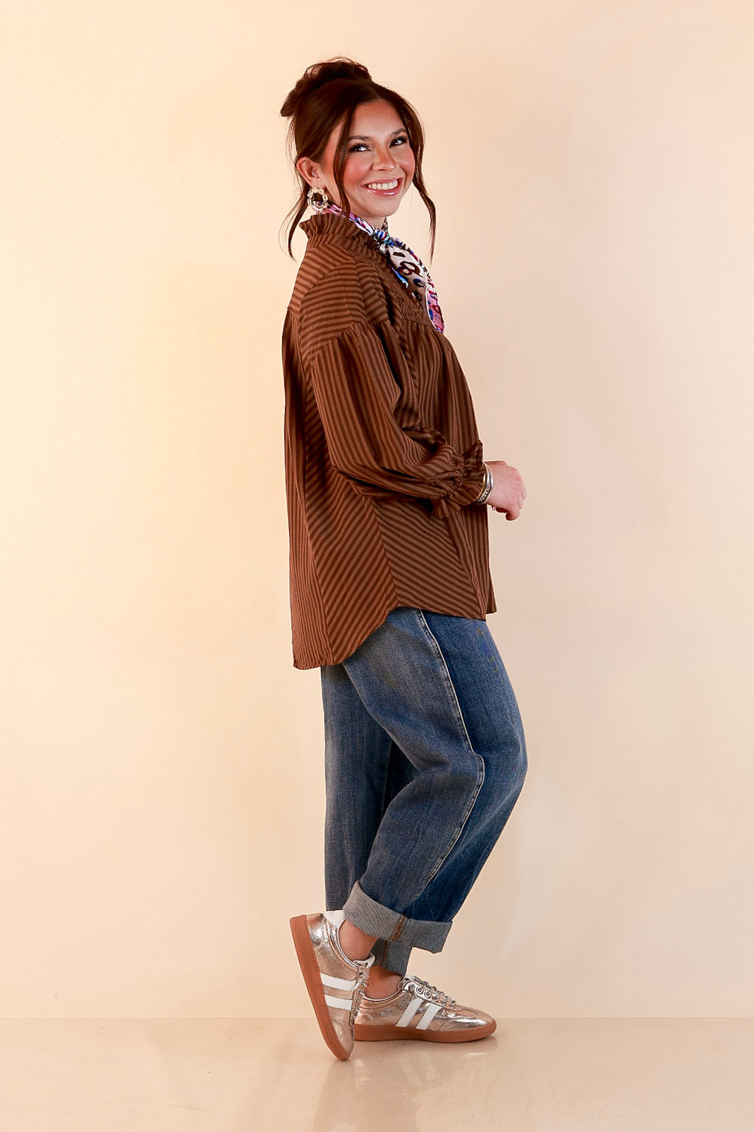 A Fine Line Smocked Ruffle Neck Long Sleeve Striped Button Front Blouse in Chocolate Brown