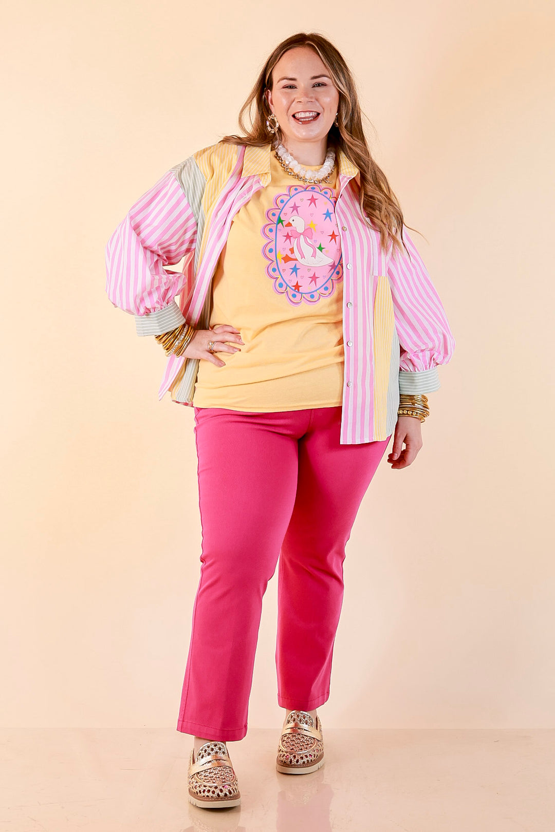 Goose on the Loose Whimsical Pink Background with Stars and Hearts Goose Printed Graphic Tee in Butter Yellow