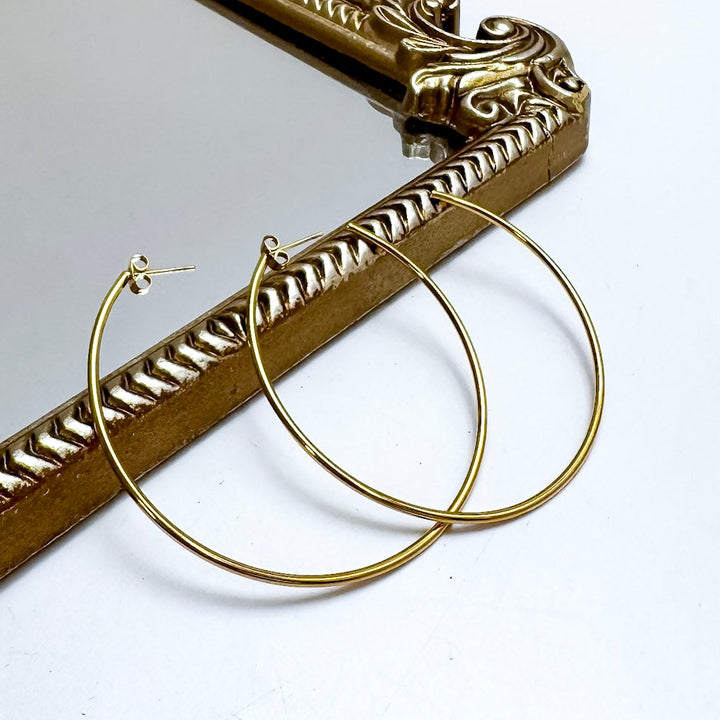 CHANSUTT PEARLS | Thin Large Hoop Earrings in Gold