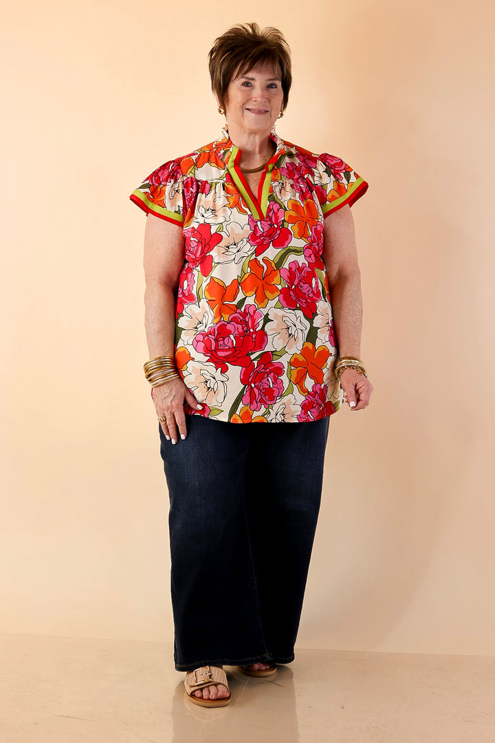 Spring Symphony Floral Print Flutter Sleeve Top with Contrast Trim Split Neckline in Pink and Orange