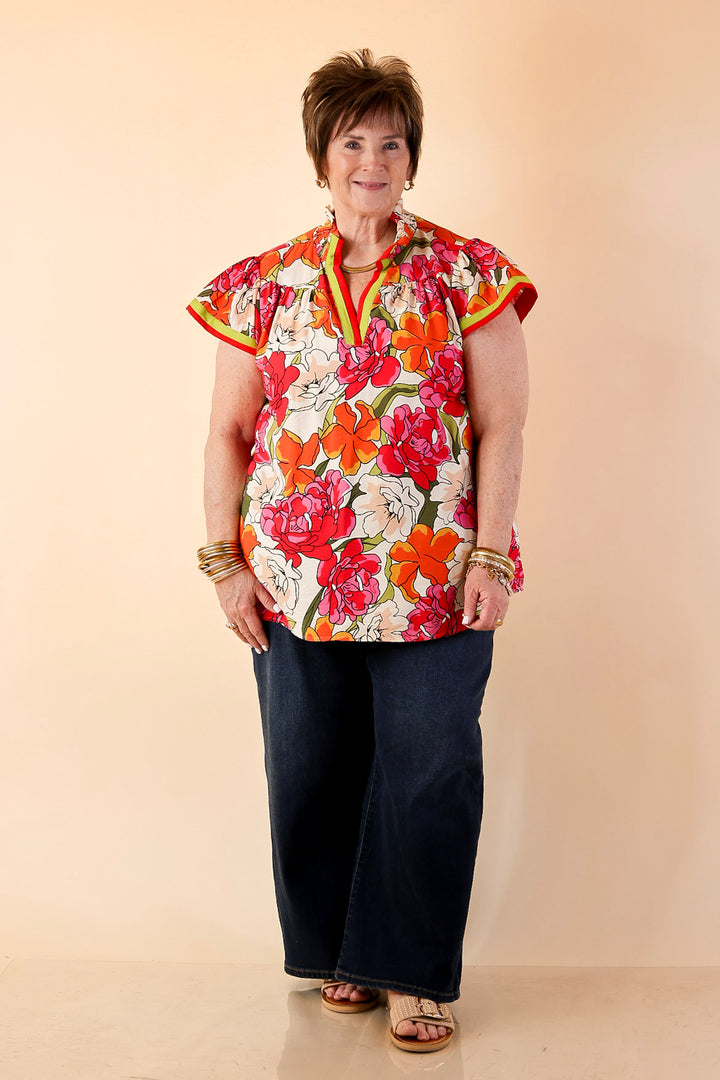 Spring Symphony Floral Print Flutter Sleeve Top with Contrast Trim Split Neckline in Pink and Orange