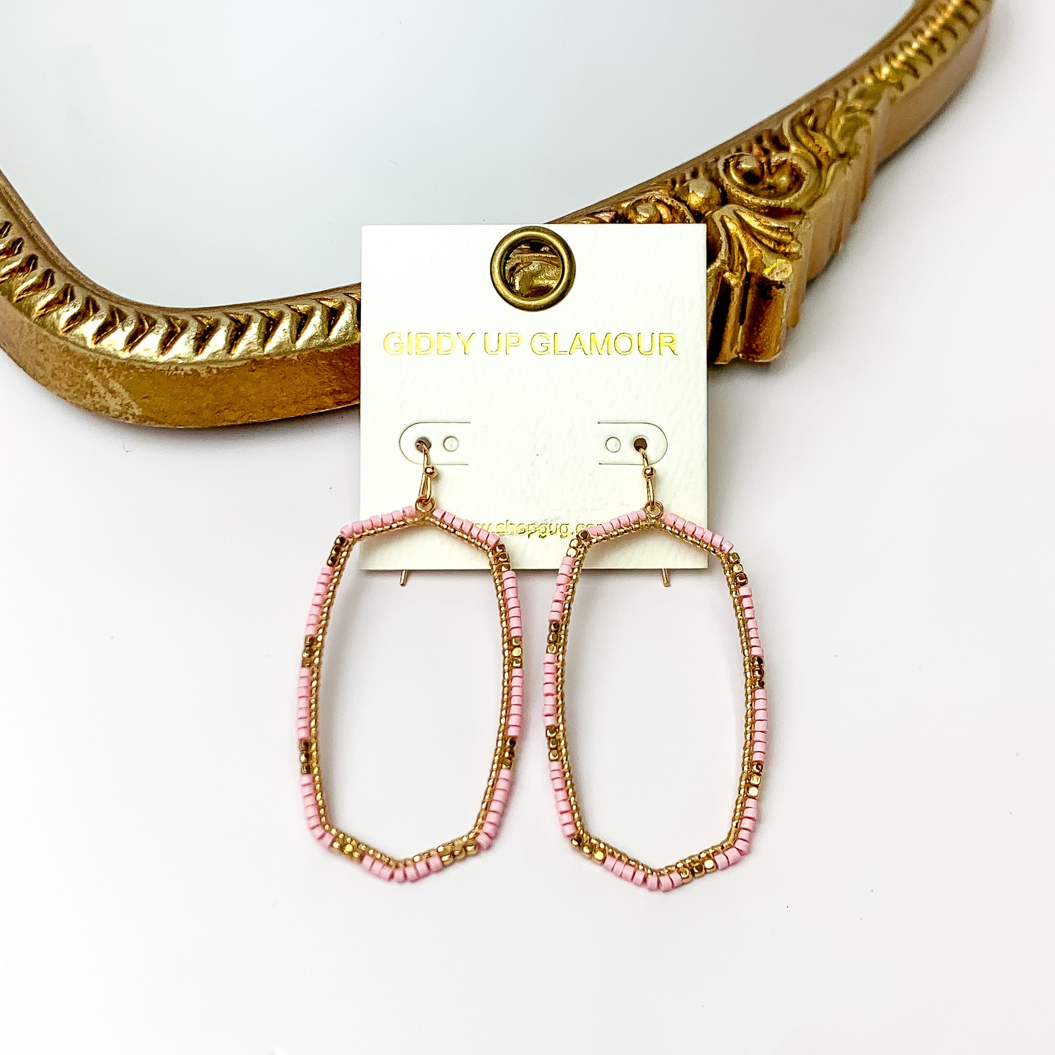 Light Pink Beaded Open Large Drop Earrings with Gold Tone Accessory. Pictured on a white background with a gold frame through it.