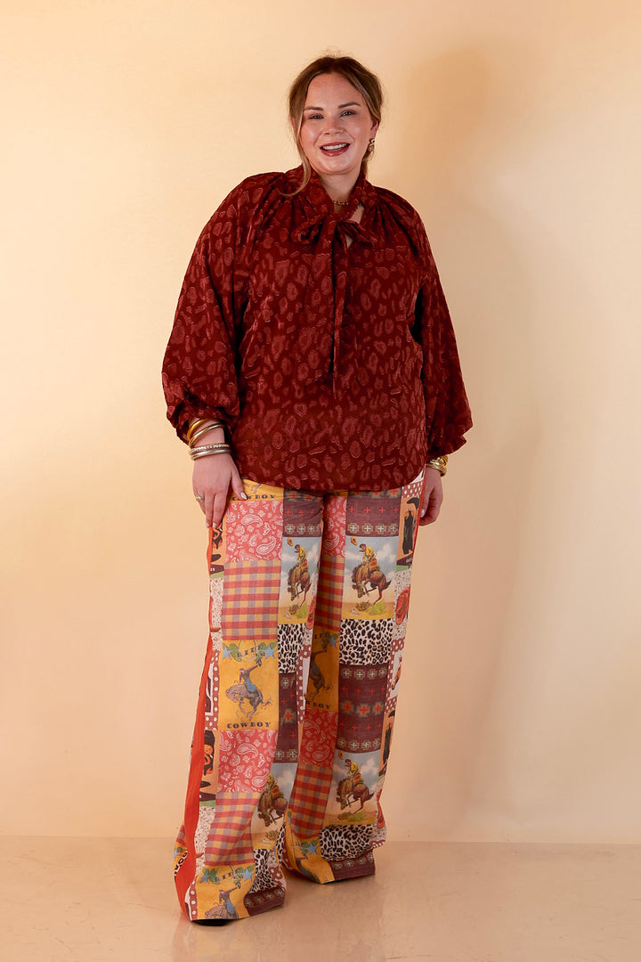Commanding Attention Tie Neck Velvet Animal Print Balloon Sleeve Blouse in Burgundy