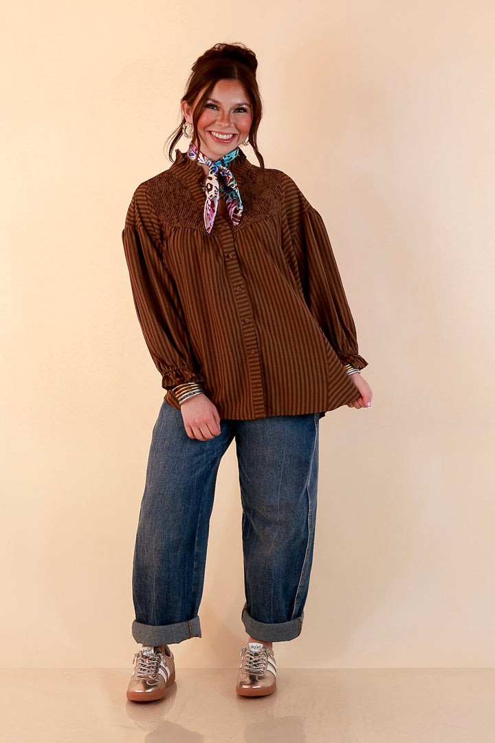 A Fine Line Smocked Ruffle Neck Long Sleeve Striped Button Front Blouse in Chocolate Brown