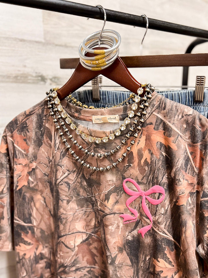 Simply Southern | Southern Belle Front &amp; Back Pink Bow Short Sleeve Graphic T-Shirt in Camouflage