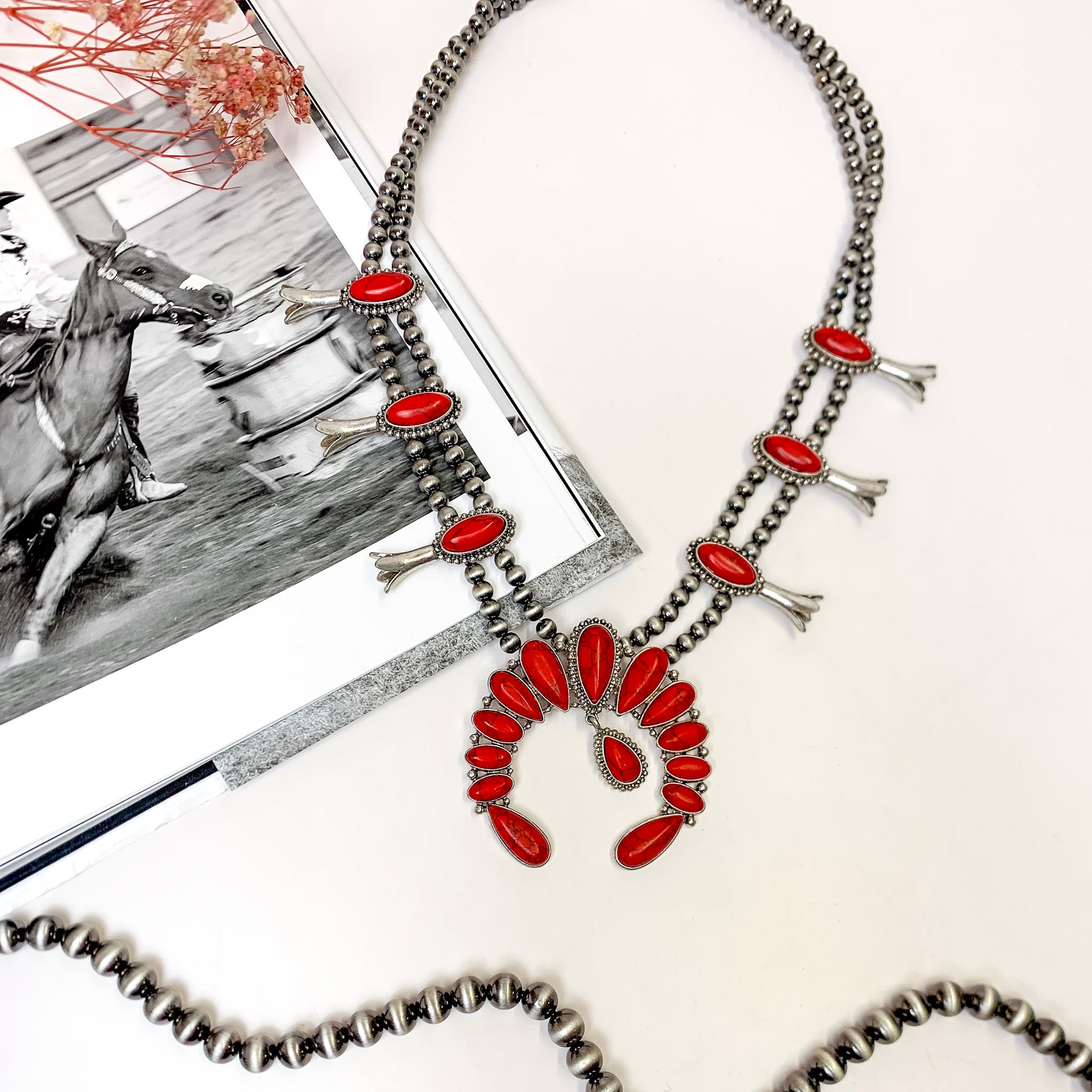 She's Gone Country Squash Blossom Necklace with Naja Pendant and Faux Stone Dangle in Red