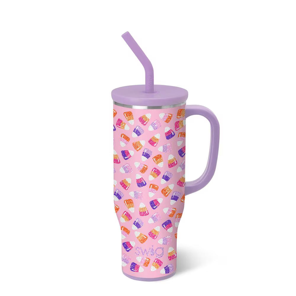 Pink tumbler with colorful pattern and purple lid and handle on a white background
