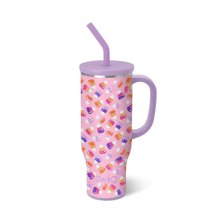 Pink tumbler with colorful pattern and purple lid and handle on a white background