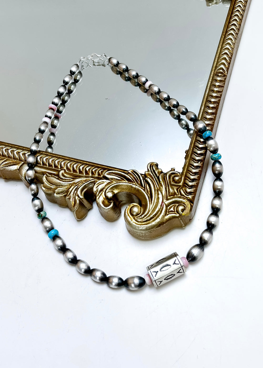 Navajo pearl necklace with turquoise and pink conch beads and stamped barrel bead, 17 inch sterling silver necklace