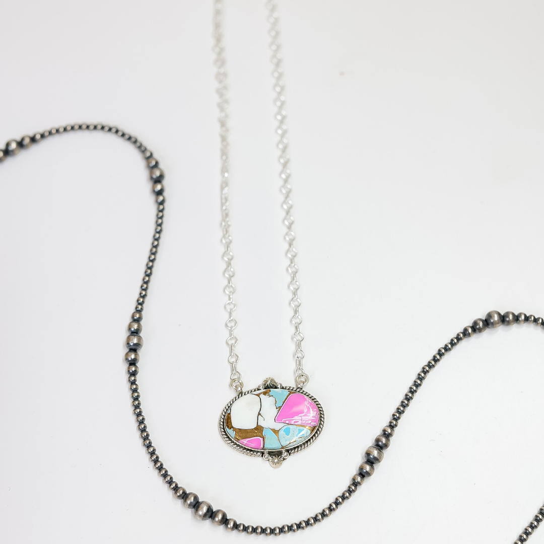 Necklace with a colorful pendant on a white background