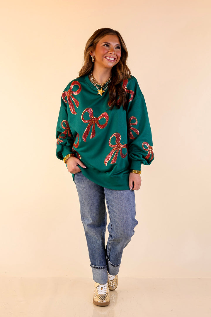 Wrapped in Style Crewneck Sweatshirt with Sequin Red Bows in Dark Green