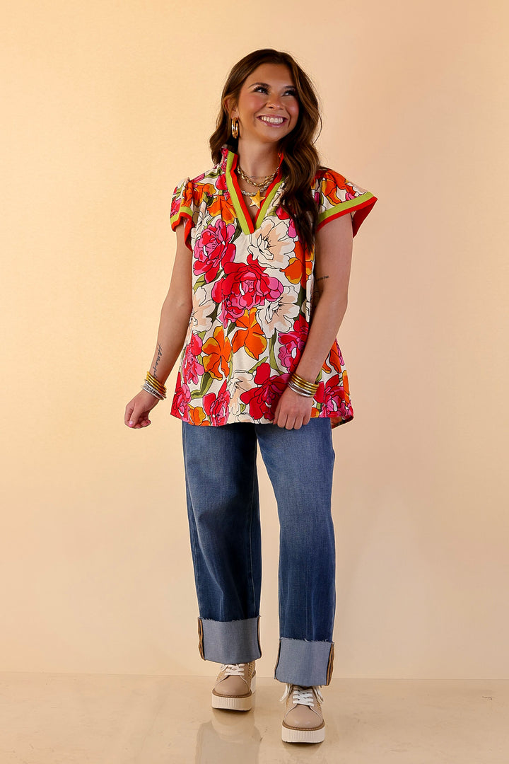 Spring Symphony Floral Print Flutter Sleeve Top with Contrast Trim Split Neckline in Pink and Orange