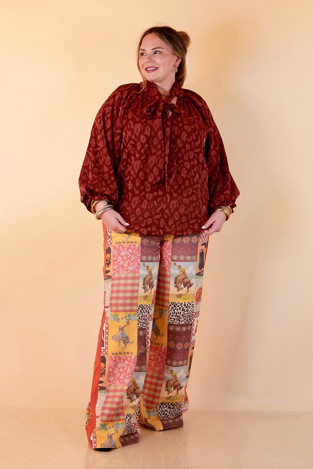 Commanding Attention Tie Neck Velvet Animal Print Balloon Sleeve Blouse in Burgundy