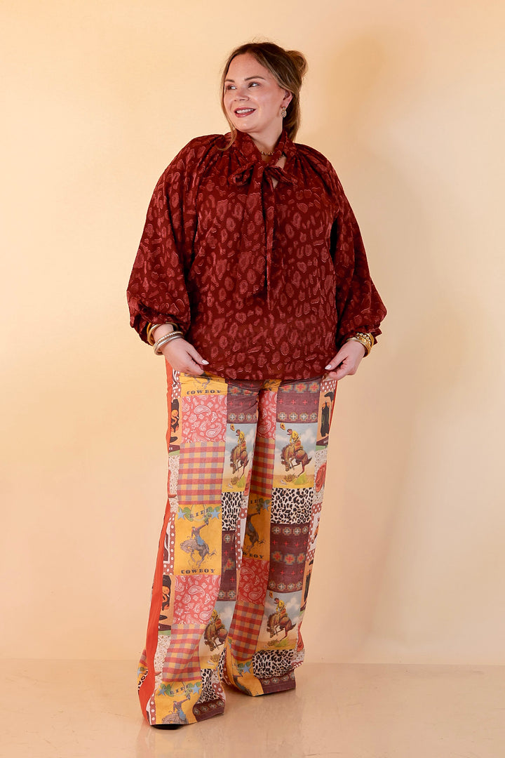 Commanding Attention Tie Neck Velvet Animal Print Balloon Sleeve Blouse in Burgundy