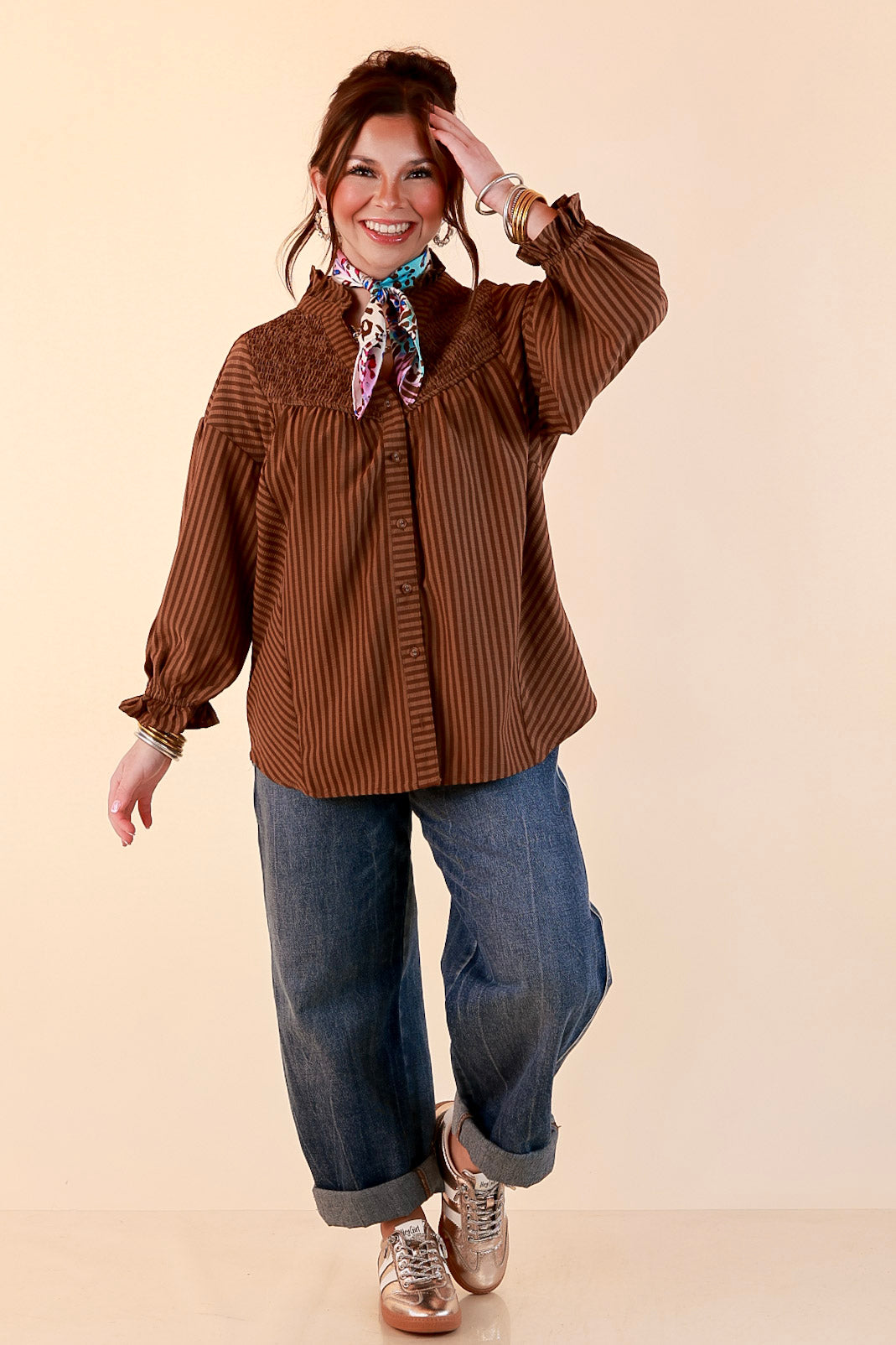 A Fine Line Smocked Ruffle Neck Long Sleeve Striped Button Front Blouse in Chocolate Brown