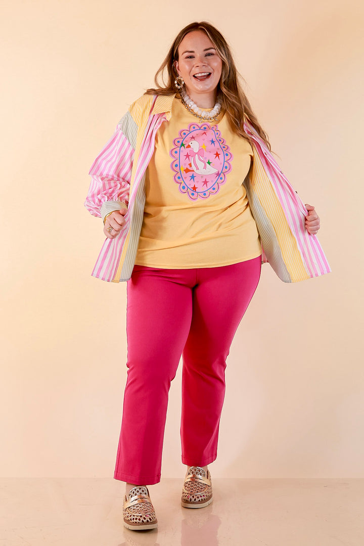 Goose on the Loose Whimsical Pink Background with Stars and Hearts Goose Printed Graphic Tee in Butter Yellow