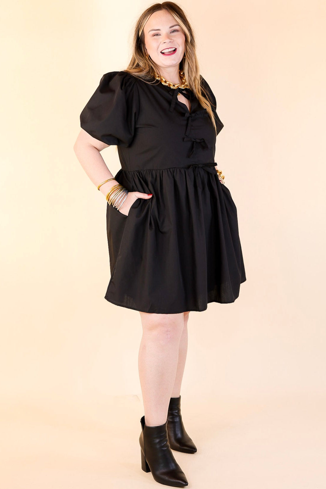 Short and Sweet Dress with Short Puff Sleeves and Bows in Black