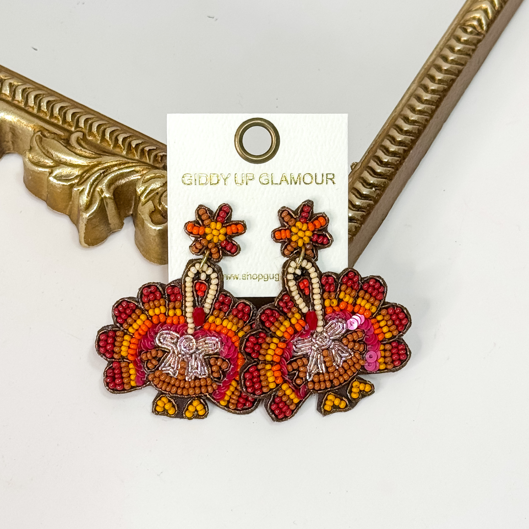 Beaded Thanksgiving turkey earrings 🦃 lightweight statement jewelry with red, orange, gold, and brown beads.